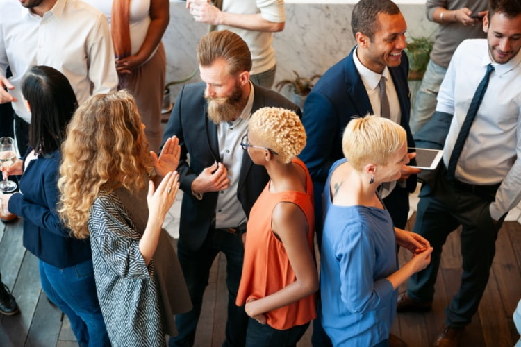 business professionals networking with each other at a conference 